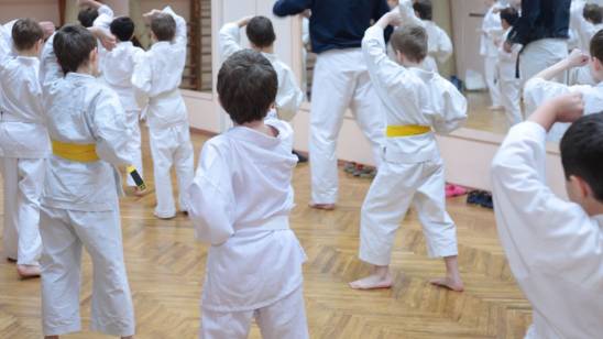 Children engaging in martial arts karate lesseons at Grubers Karate kids class in Gurnee